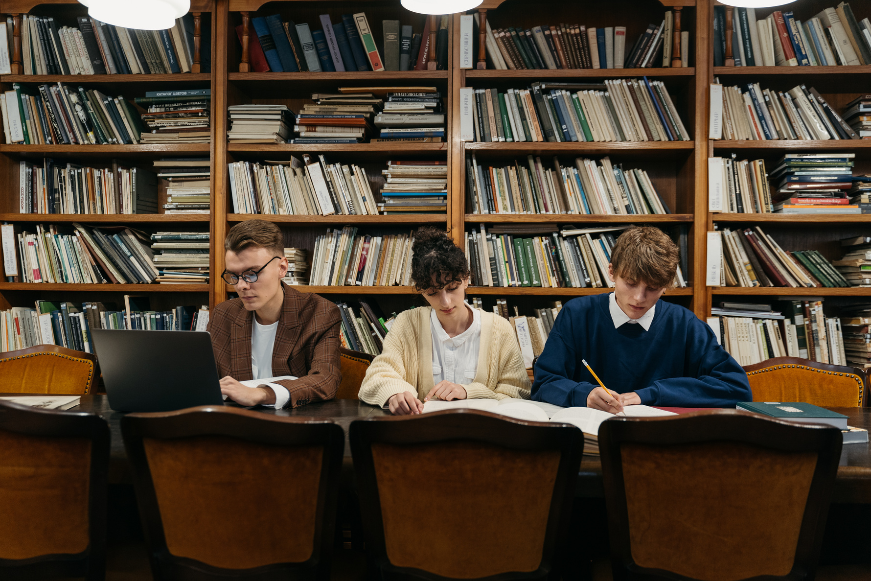 Three College Students in the Library