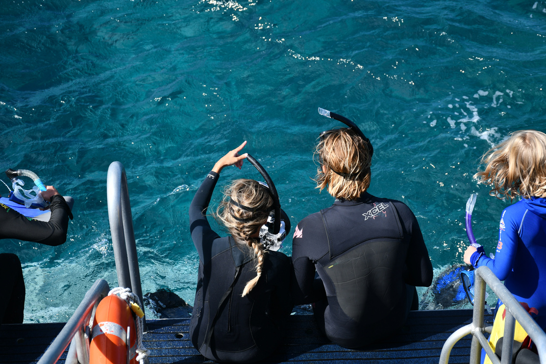 Divers on the Platform in the Sea